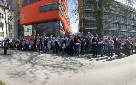 MDC employees and activists in front of an MDC building