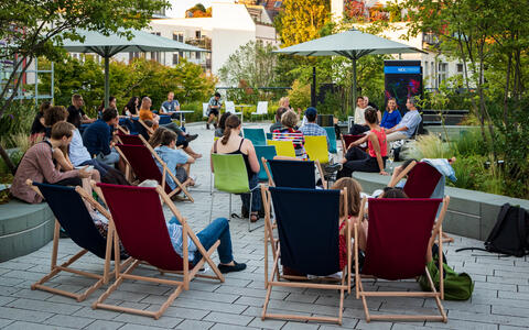 People on deck chairs