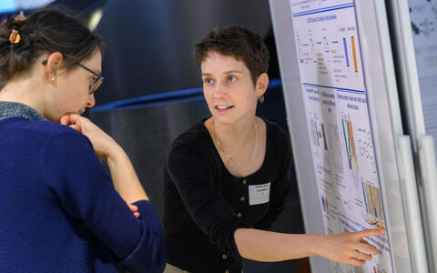 two women at a poster presentation