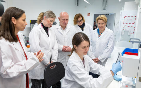 a group of people in lab coats