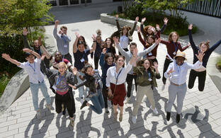 All 20 Attendees jump in front of BIMSB building