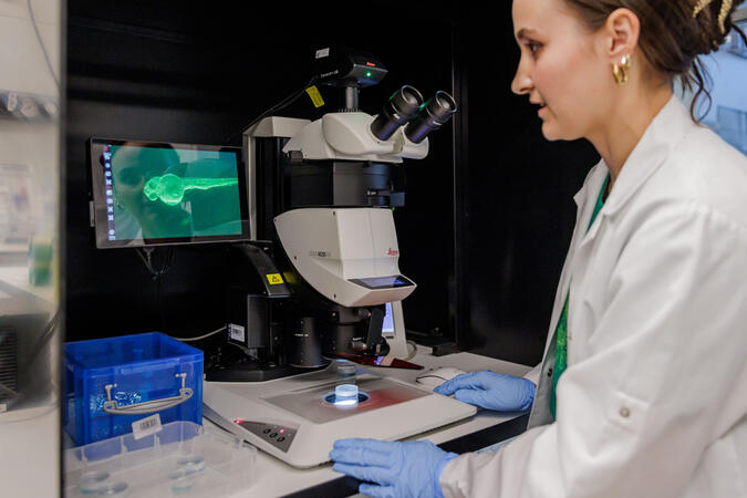 woman scientist at a microscope