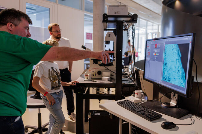 scientist showing research details on a screen