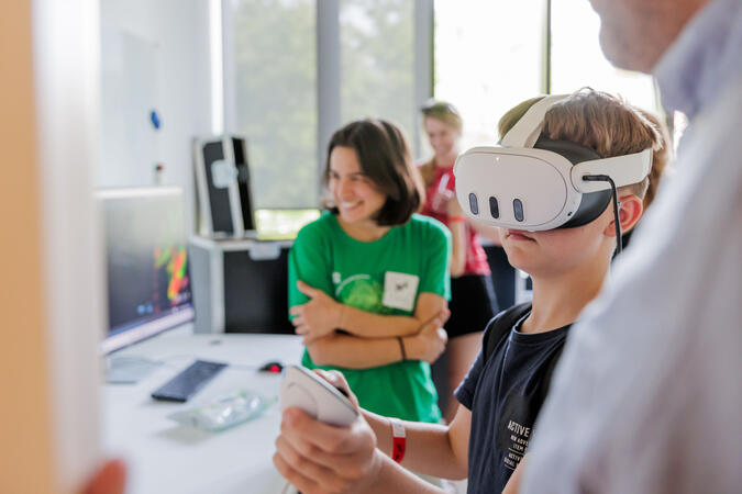 kid with VR glasses in a lab