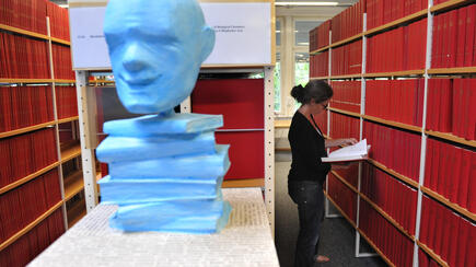 Woman reading in MDC library