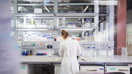 woman at a bench in a lab